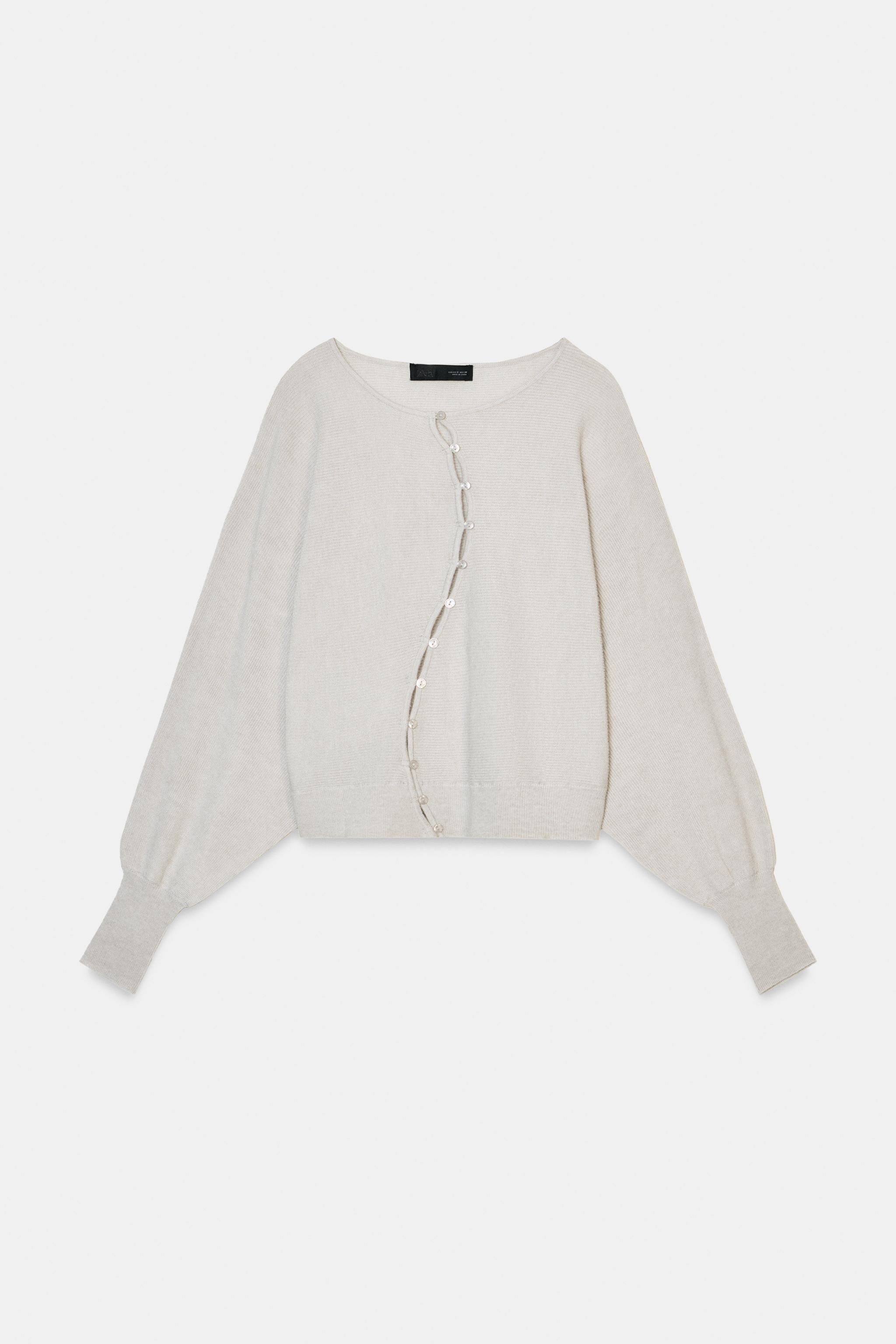 GILET BOUTONNÉ SUR LE CÔTÉ EN MAILLE